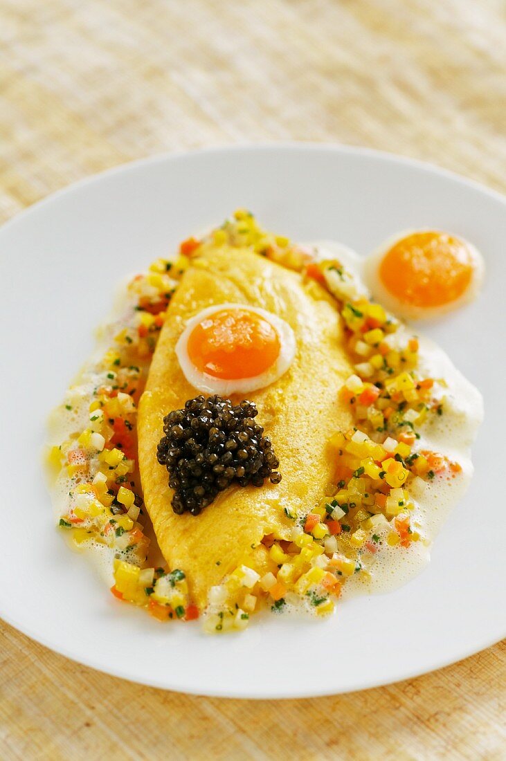 Quail's egg omelette on a bed of vegetable vinaigrette with beluga caviar