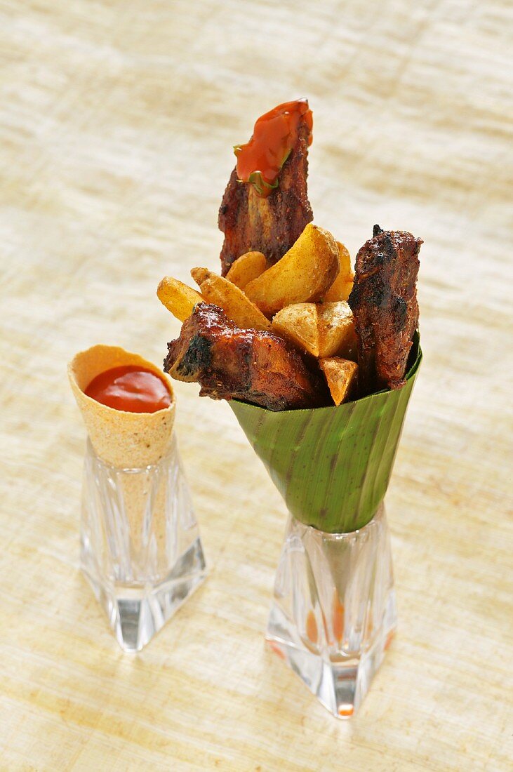 Spare ribs with potato wedges and a tomato dip