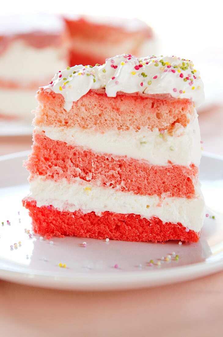 A slice of pink cream cake