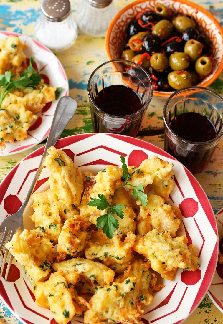 Cod fritters, red wine and olives