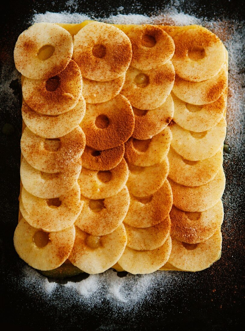 An unbaked apple and cinnamon tart