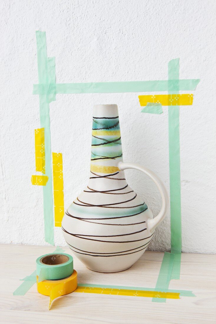 A 1950s-style vase in a masking tape frame