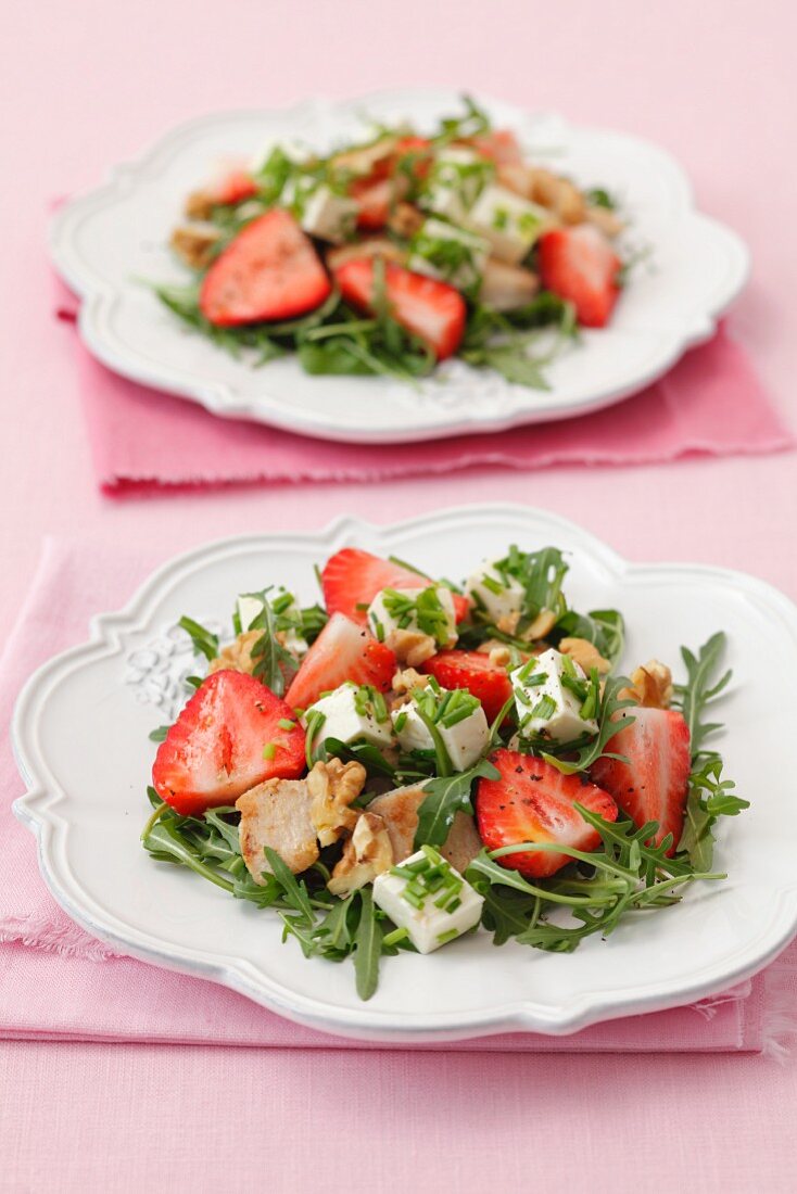 Rocket and strawberry salad with feta cheese, chicken and walnuts