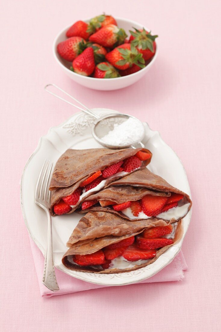 Chocolate pancakes with vanilla quark and strawberries