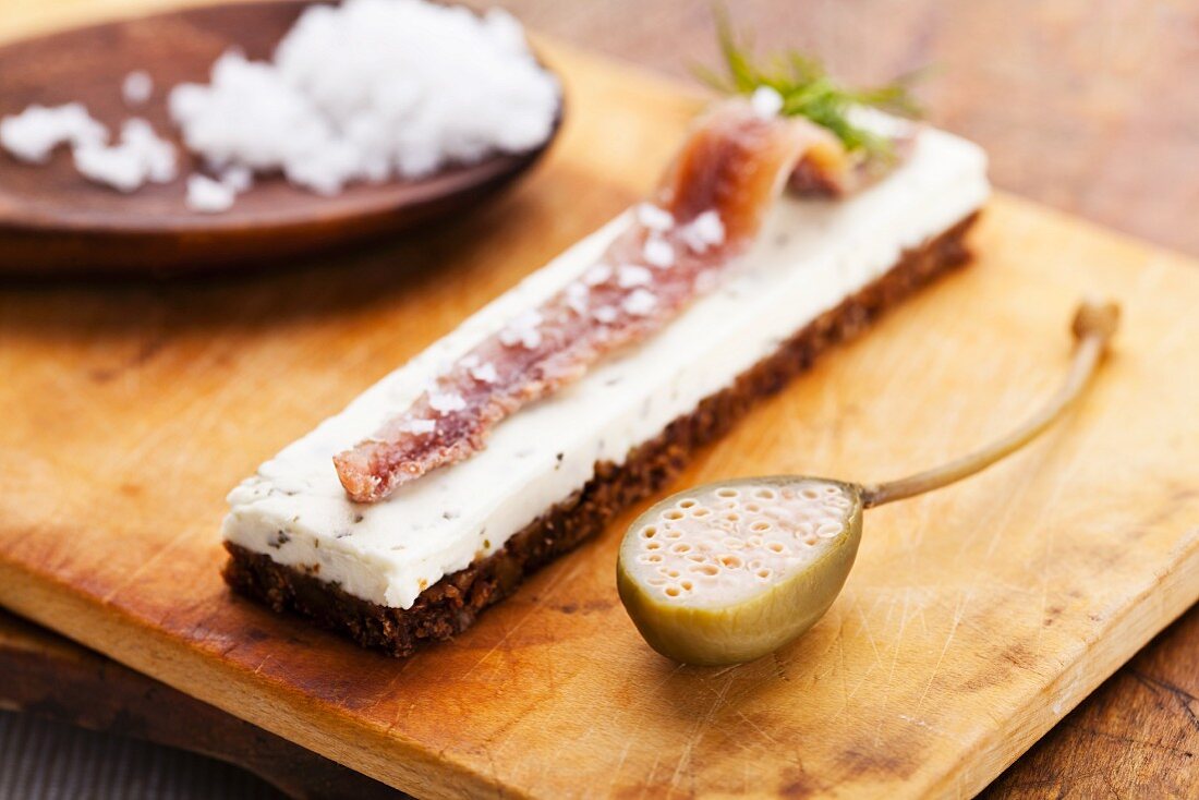 Pumpernickel topped with sardine fillets and cream cheese