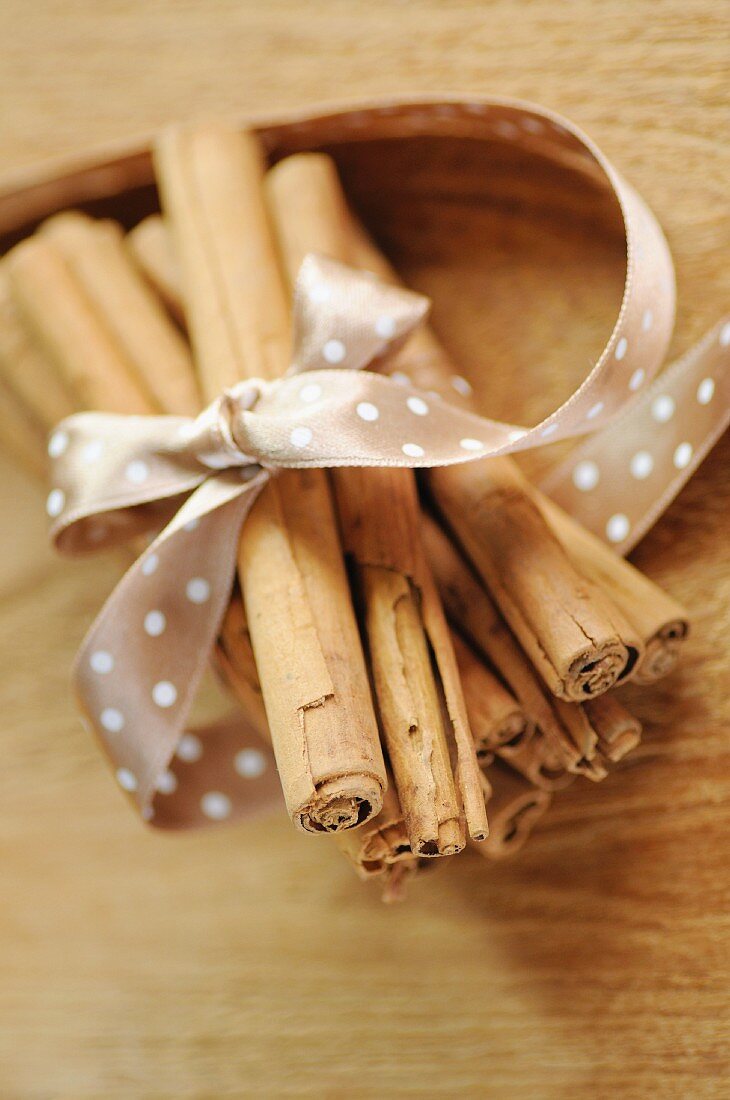 A bundle of cinnamon stick tied with a satin bow