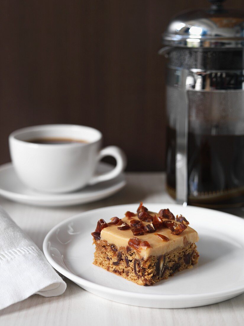 Date and creme slice and a cup of coffee