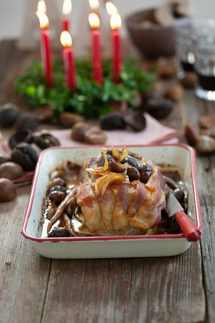 Roast pork in bacon with chestnuts