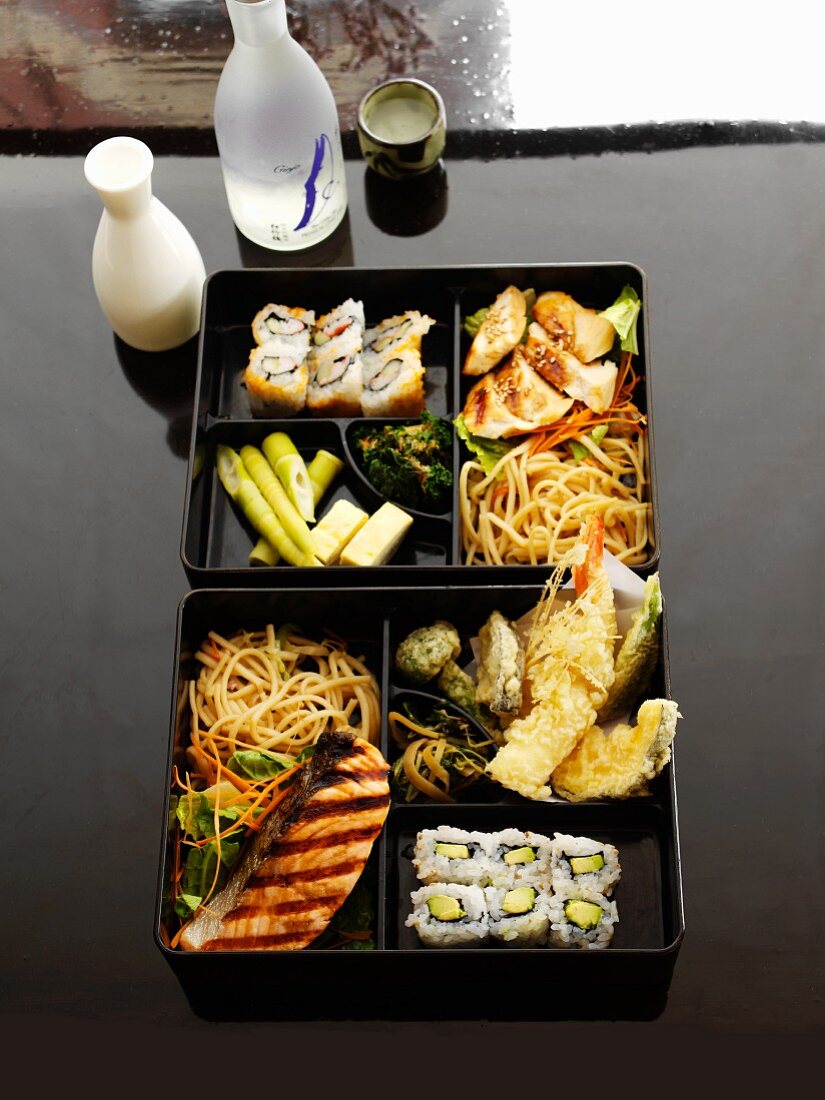 Japanese Bento Box with Sukiyaki, Tempura Vegetables and Sushi