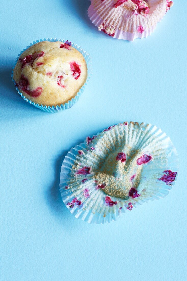 Redcurrant muffins and empty paper cases
