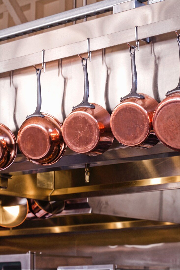 Copper Pots Hanging in a Kitchen