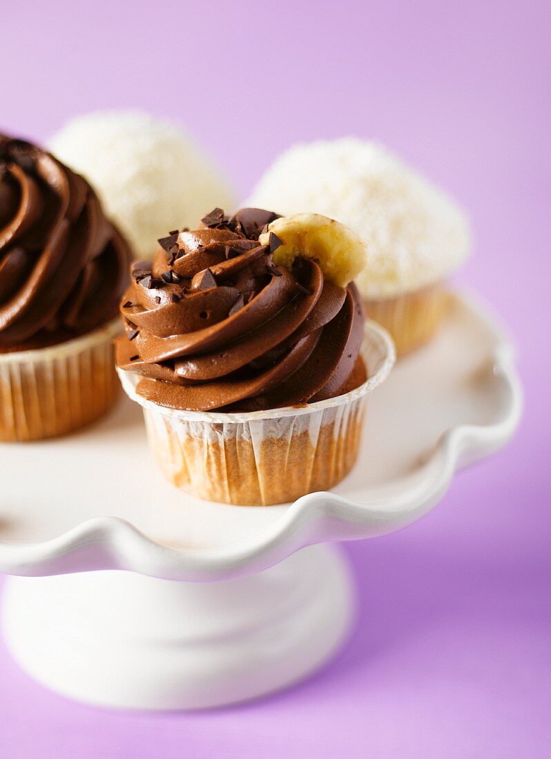 Various cupcakes on a cake stand