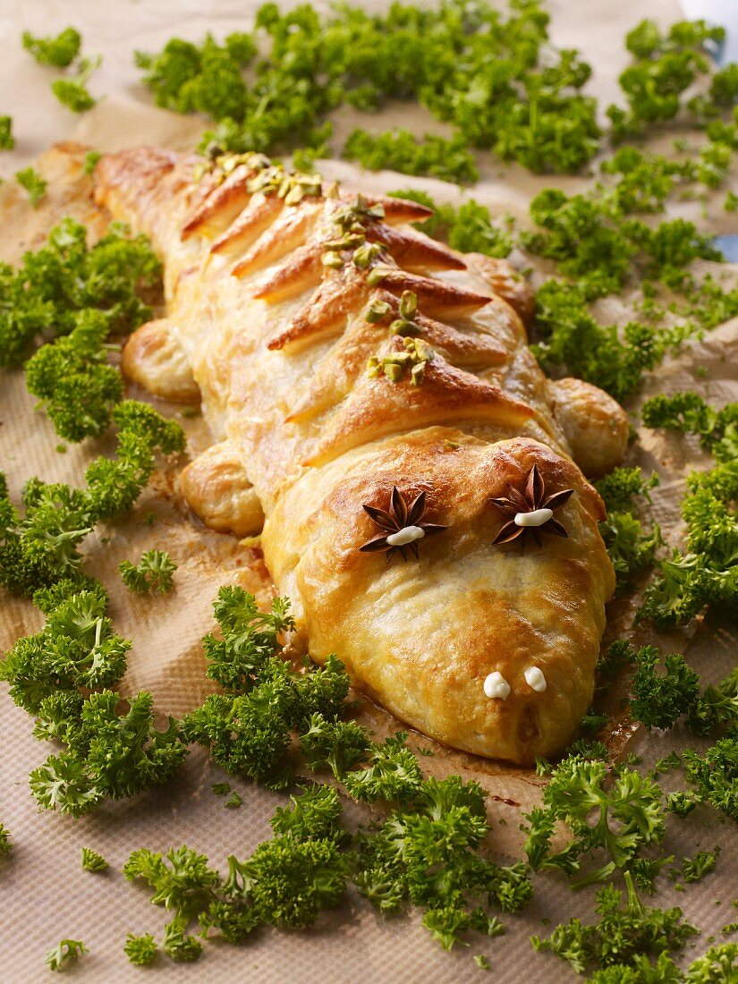 Minced meat wrapped in puff pastry shaped like a crocodile