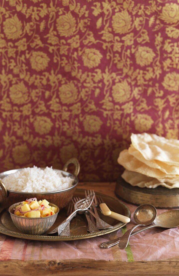 A table laid with rice, salad and unleavened bread (India)