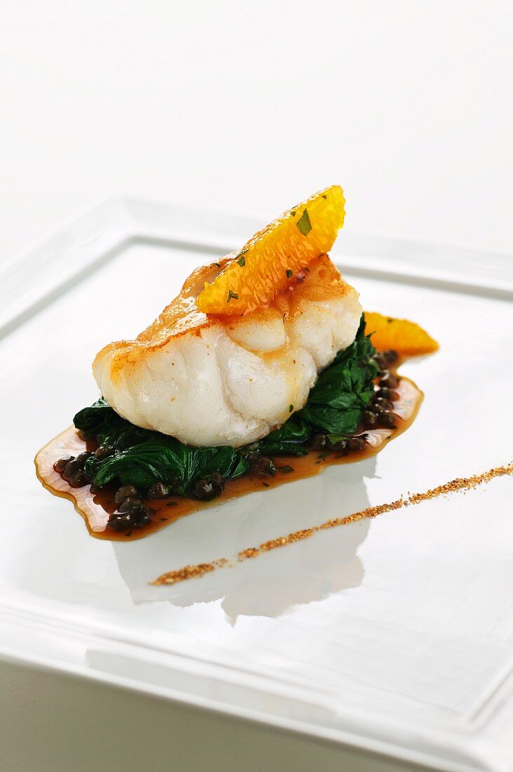 Monk fish with spinach and citrus fruit powder