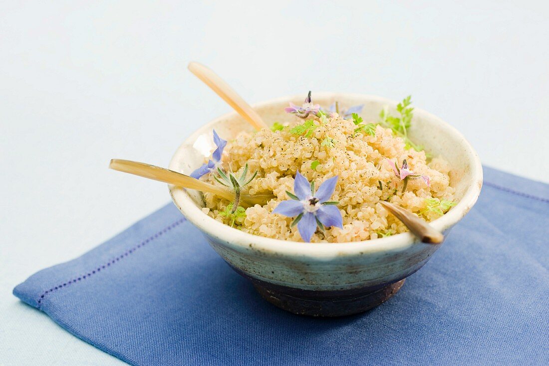 Bowl of quinoa, garnished with flower