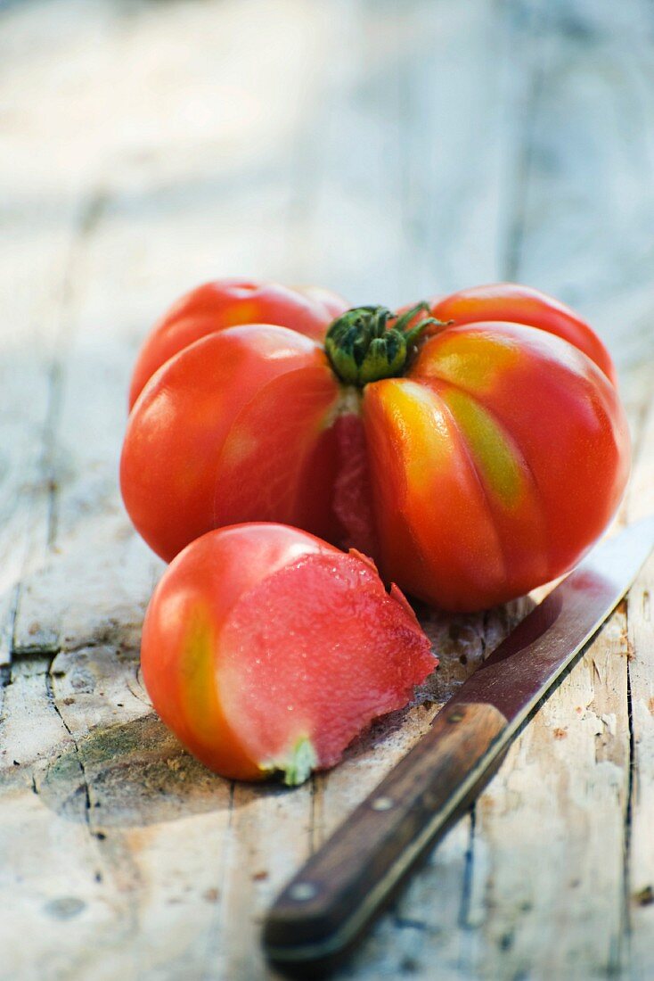 Heirloom tomato with a section cut out of it