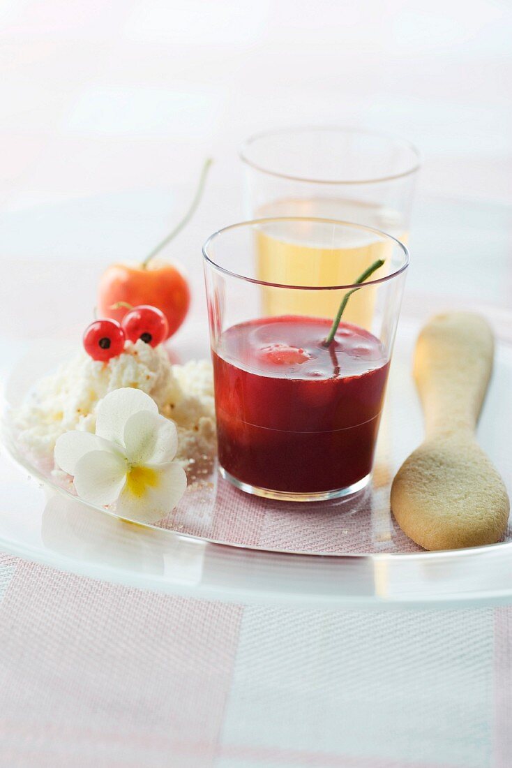 Gourmet snack tray including cocktails, cherries and spoon-shaped shortbread