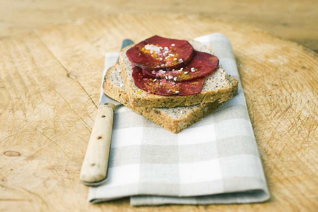 Beet slices on top of slices of bread