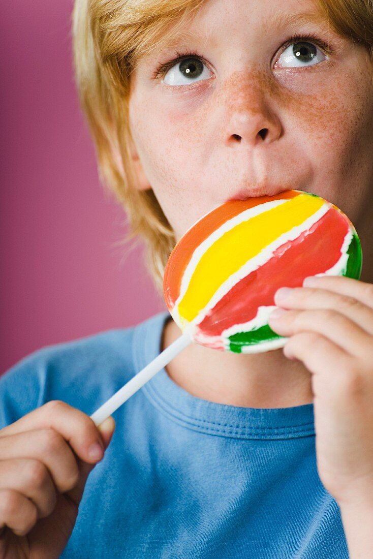 Boy eating lollipop