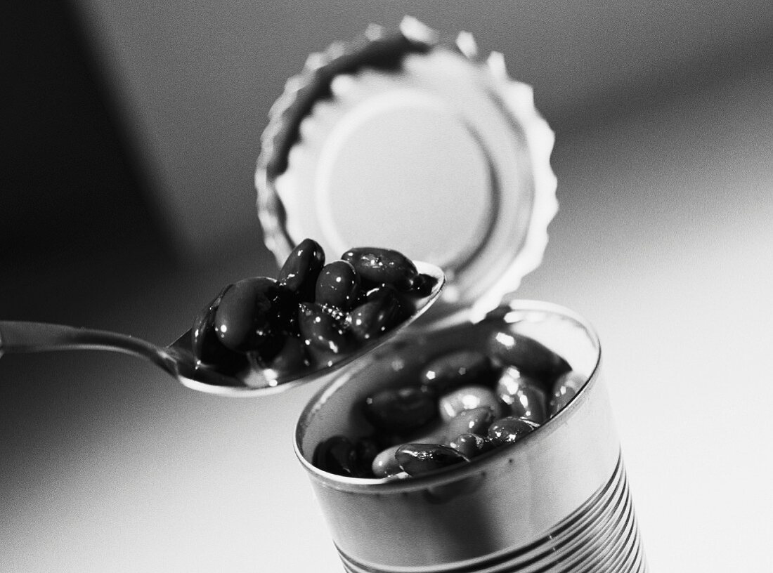 Spoon, open can of beans, close-up