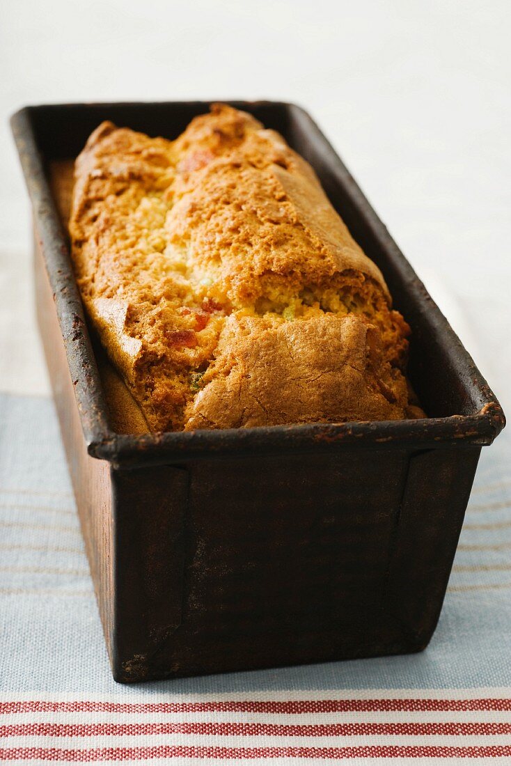 Fruit cake with ginger in a baking tin