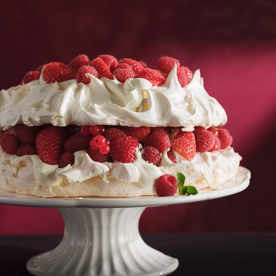 Berry pavlova on a cake stand