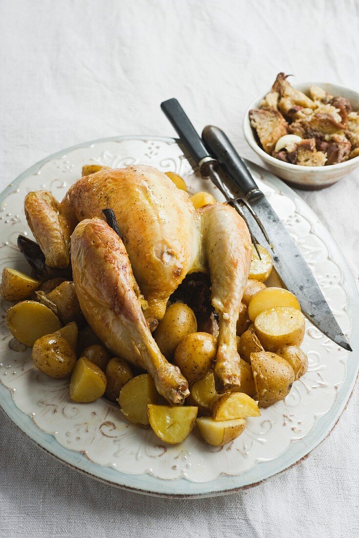 Stuffed Roast chicken with liquorice on a bed of potatoes