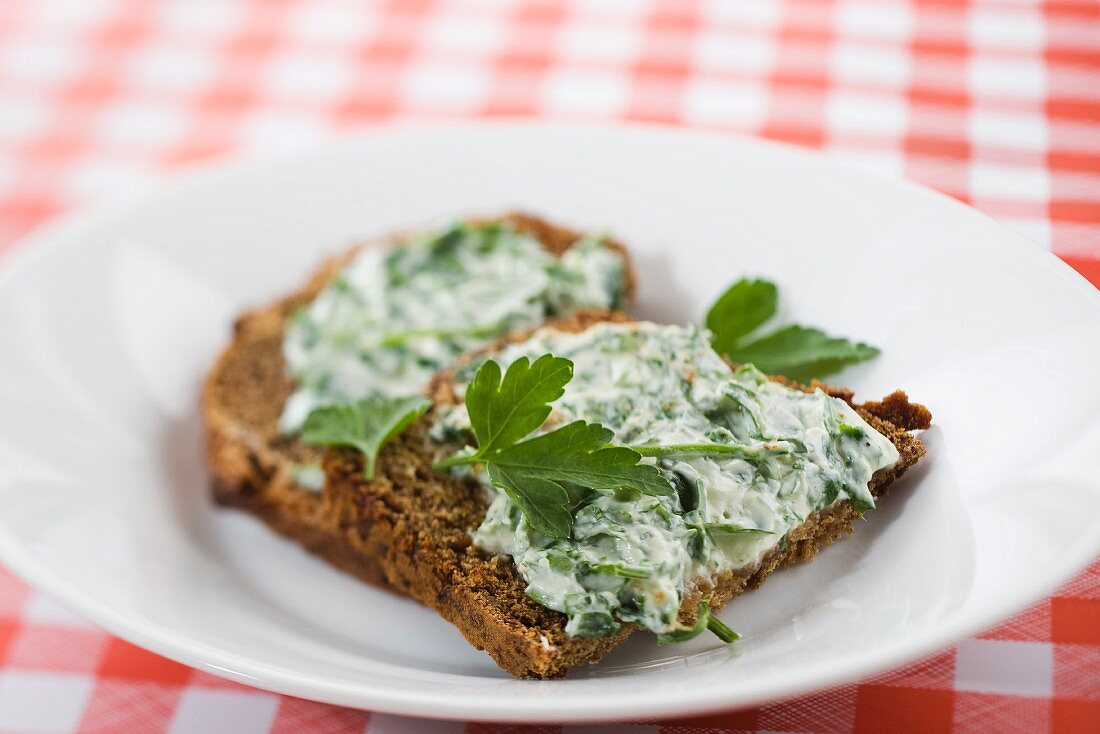 Spiced toast topped with a goat's cheese and herb spread