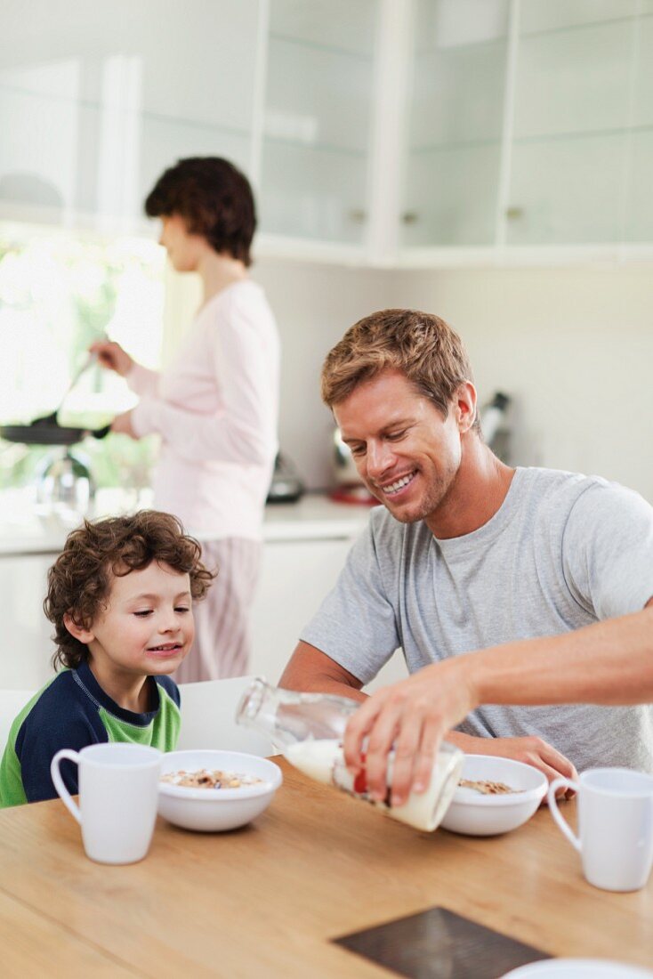 A family eating breakfast in a kitchen