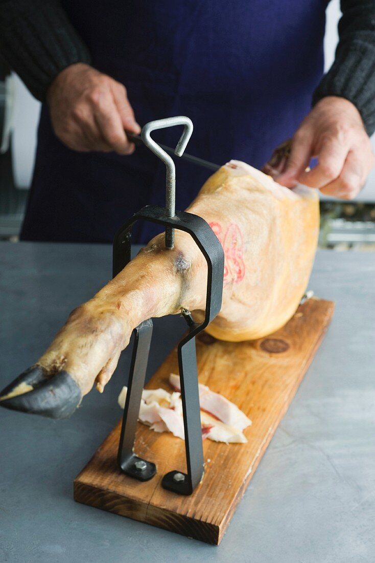 Prosciutto being sliced