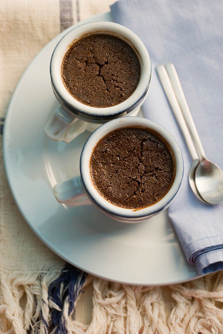 Baked chocolate pudding in coffee cups