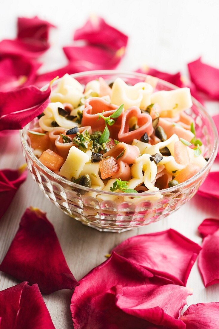 Colourful pasta salad with herbs and olives for Valentine's day