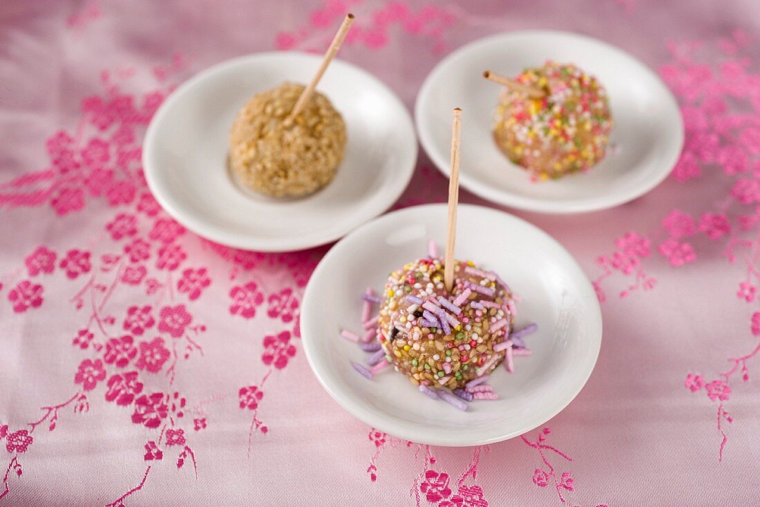Sticky rice dumplings decorated with sesame seeds and sprinkles (Asia)