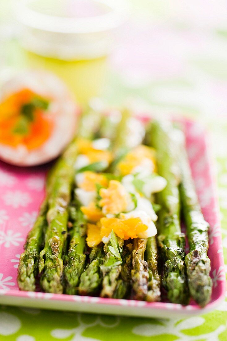 Fried asparagus with soft-boiled eggs