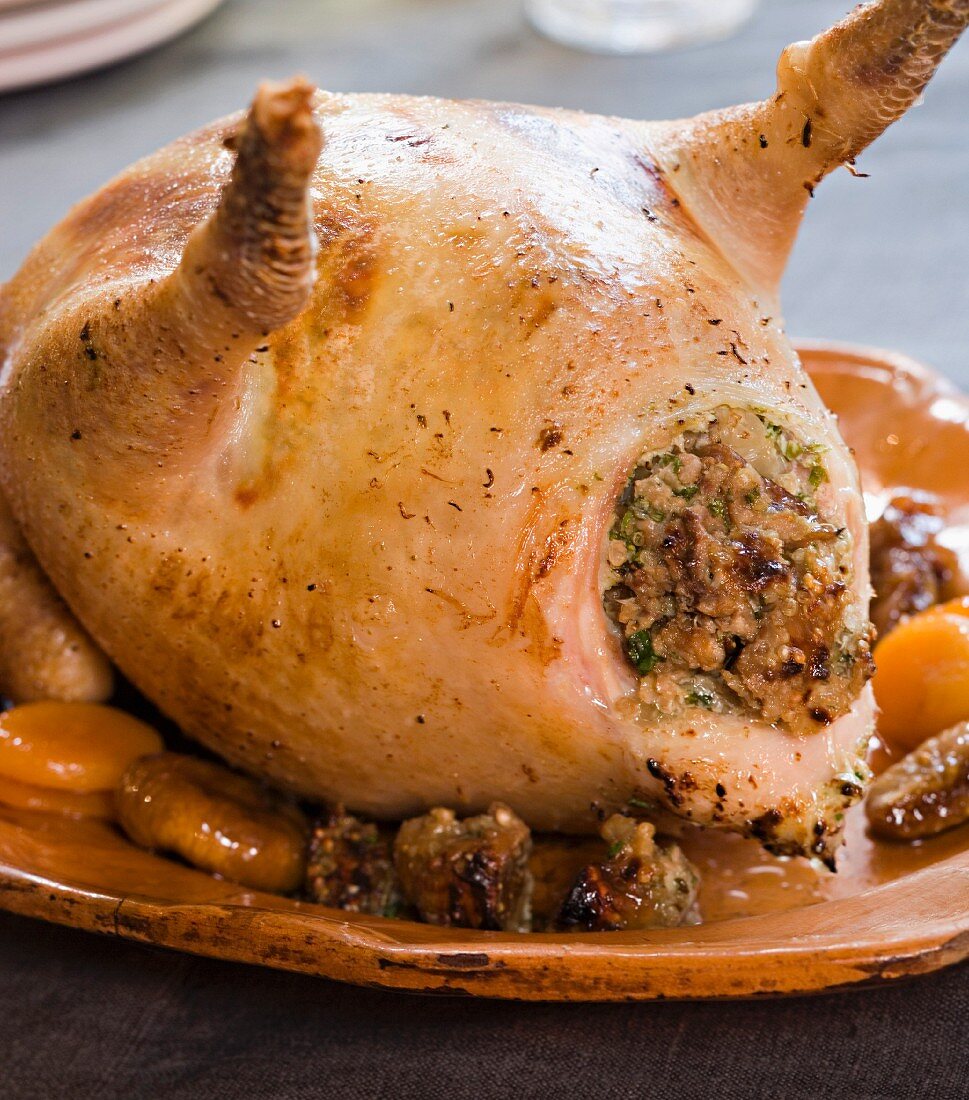 A spring chicken stuffed with quinoa and dried fruits under the skin