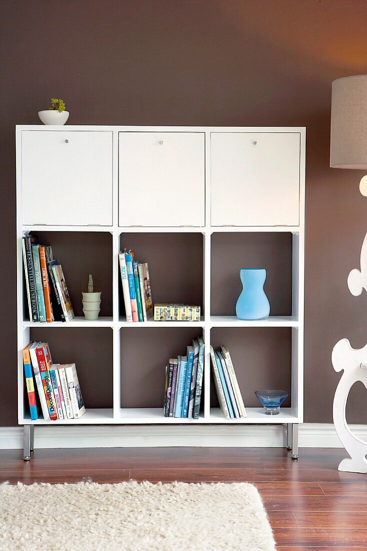 Hand-crafted shelves with integrated drinks cabinet cupboards