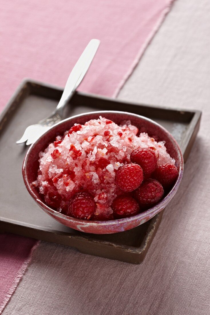Bowl of Raspberry Shaved Ice with Fresh Raspberries