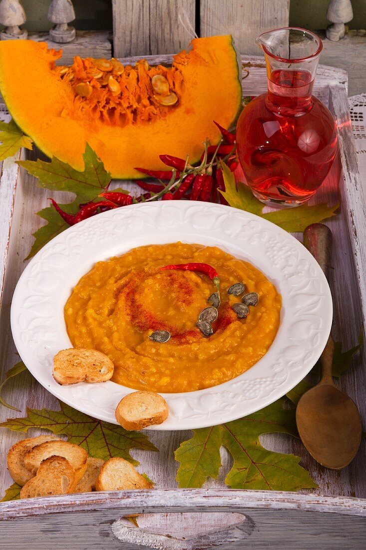 Pumpkin soup with chilli peppers and bread