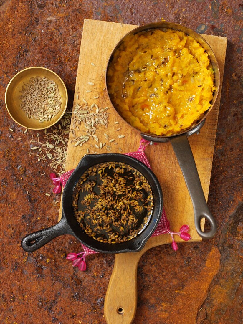 Dal tadka (cooked yellow lentils, India) and roasted fennel seeds