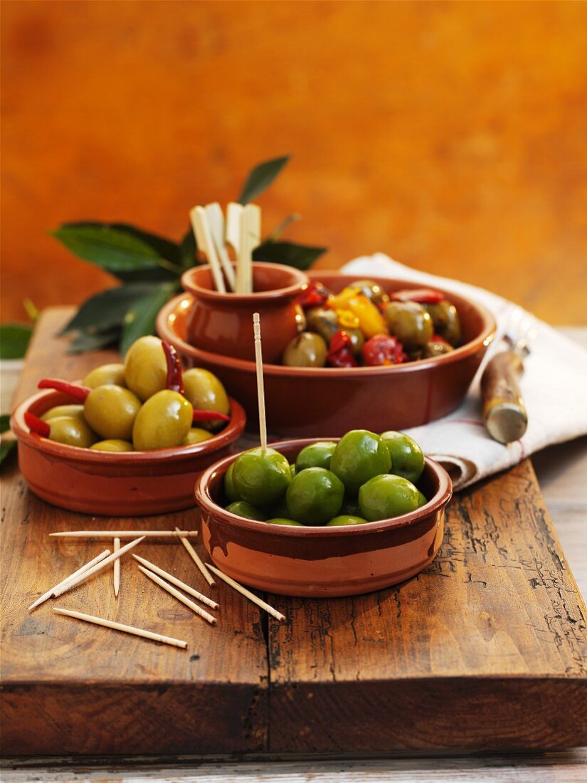 Various types of olives in bowls