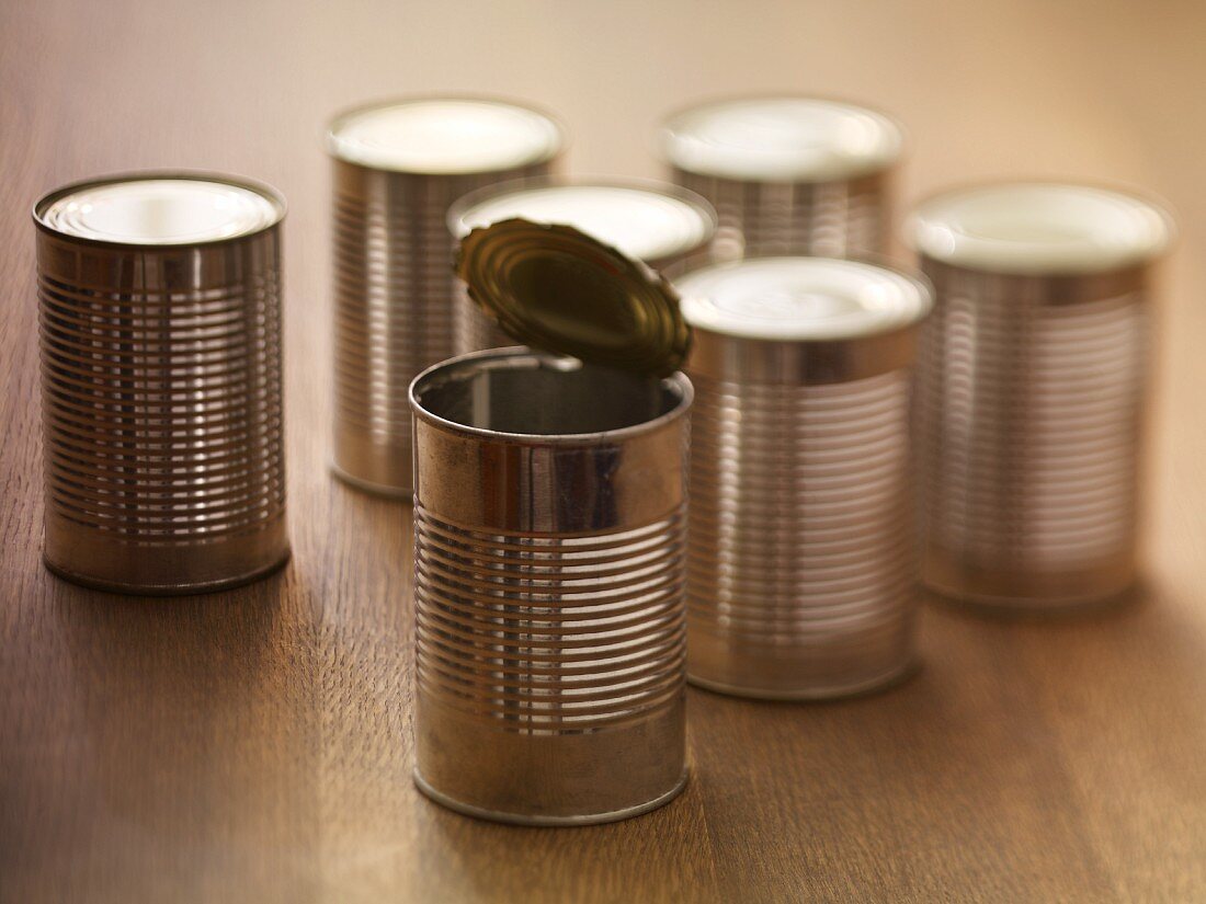 Tin cans, one opened