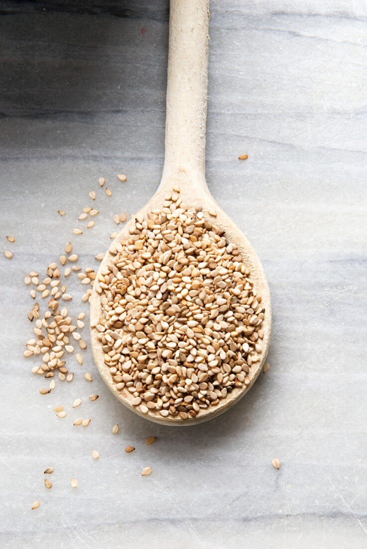 Organic Sesame Seeds in a Wooden Spoon