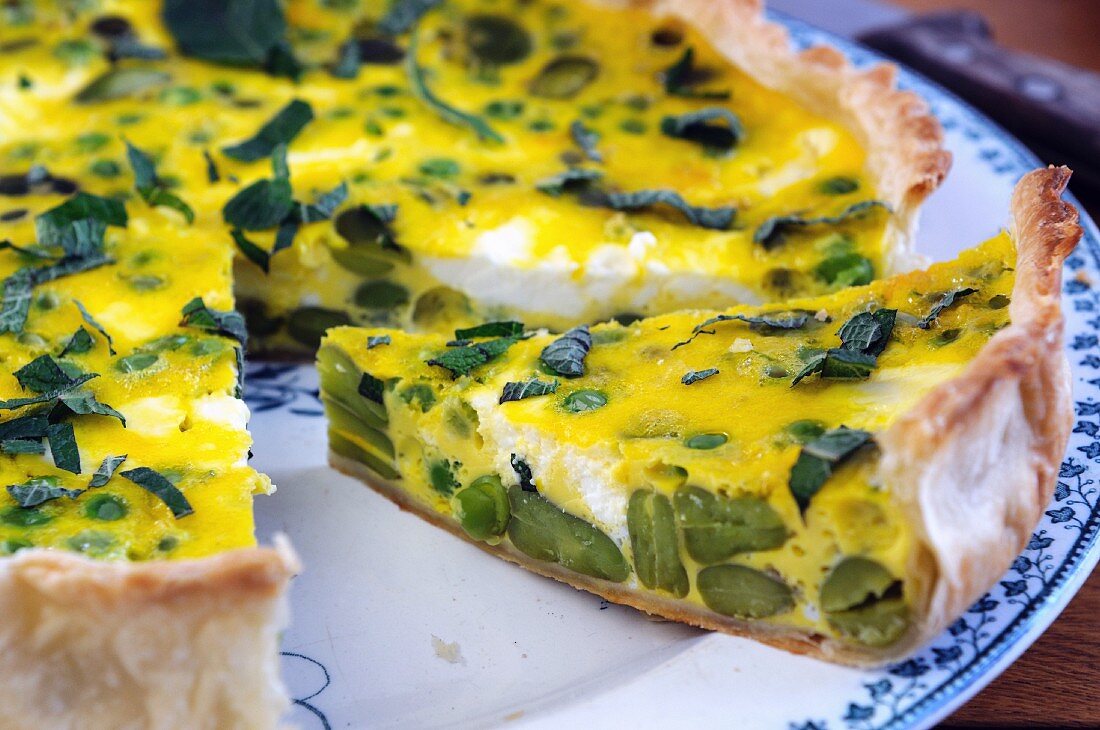 Ricotta and broad bean quiche, sliced