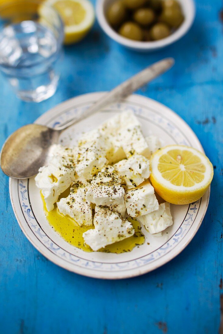 Marinated sheep's cheese with herbs, olive oil and lemons
