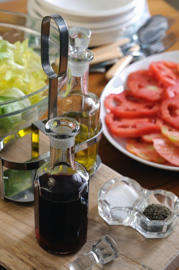 Vinegar, oil, salt and pepper for salad dressing