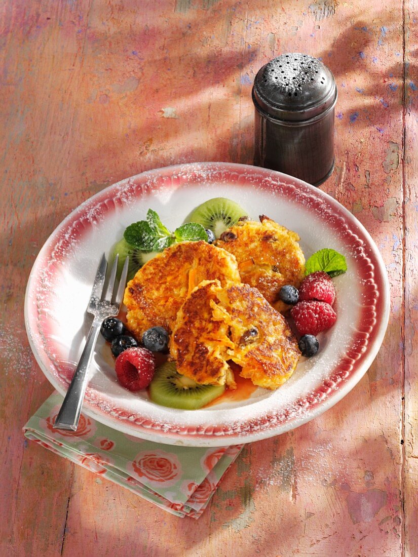 Sweet carrot cakes with fruit salad