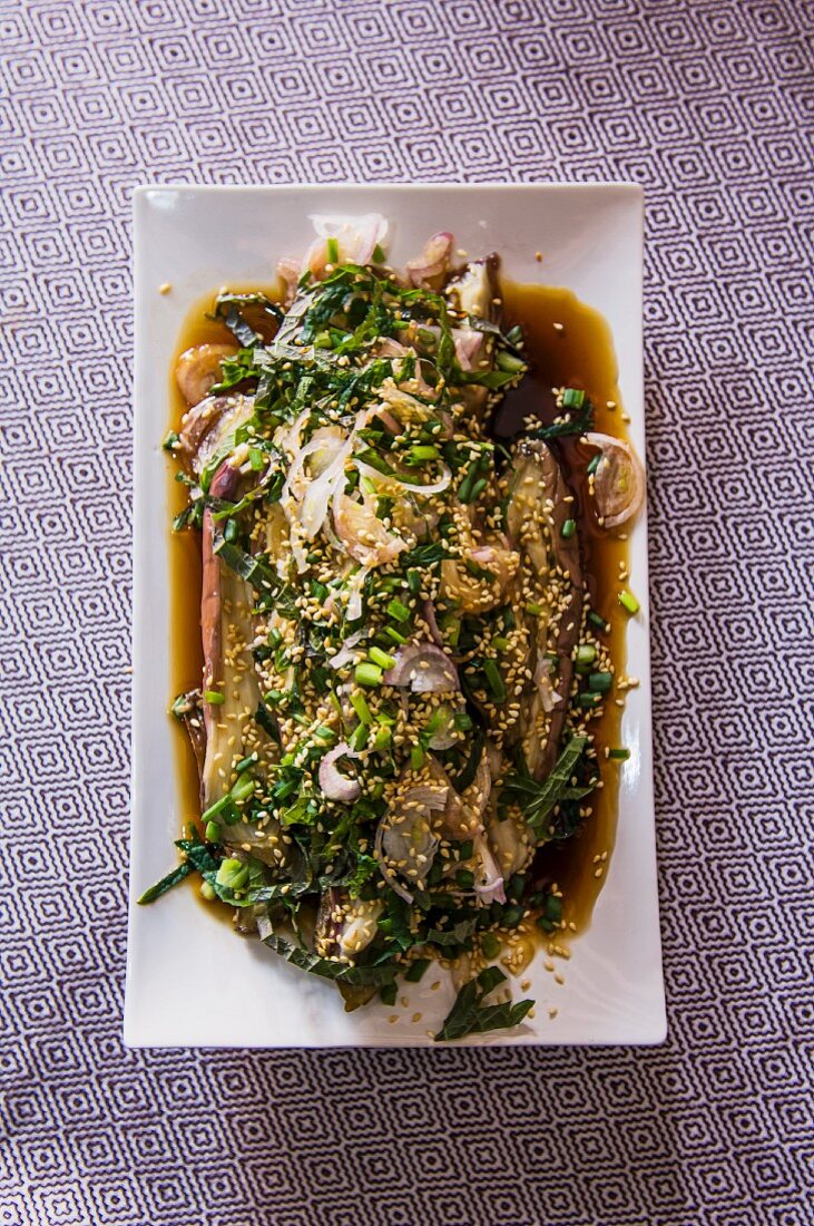 Steamed aubergines with sesame seeds, herbs and shiso