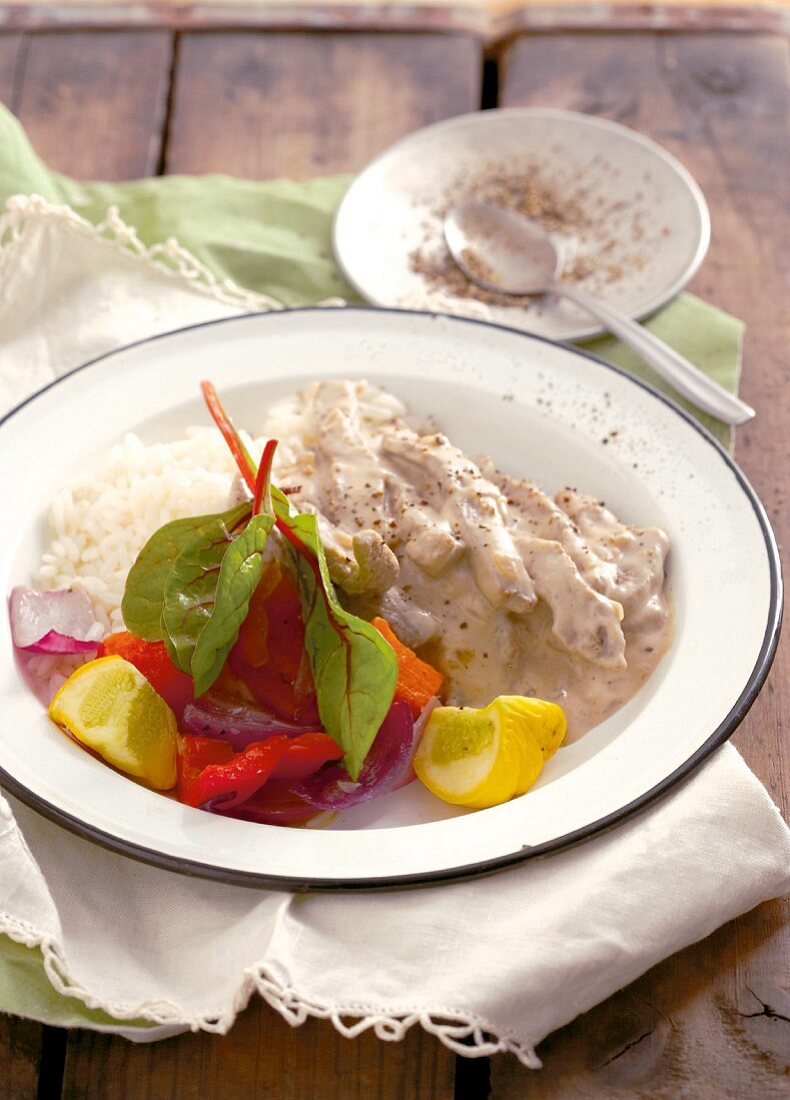 Beef stroganoff with rice and vegetables