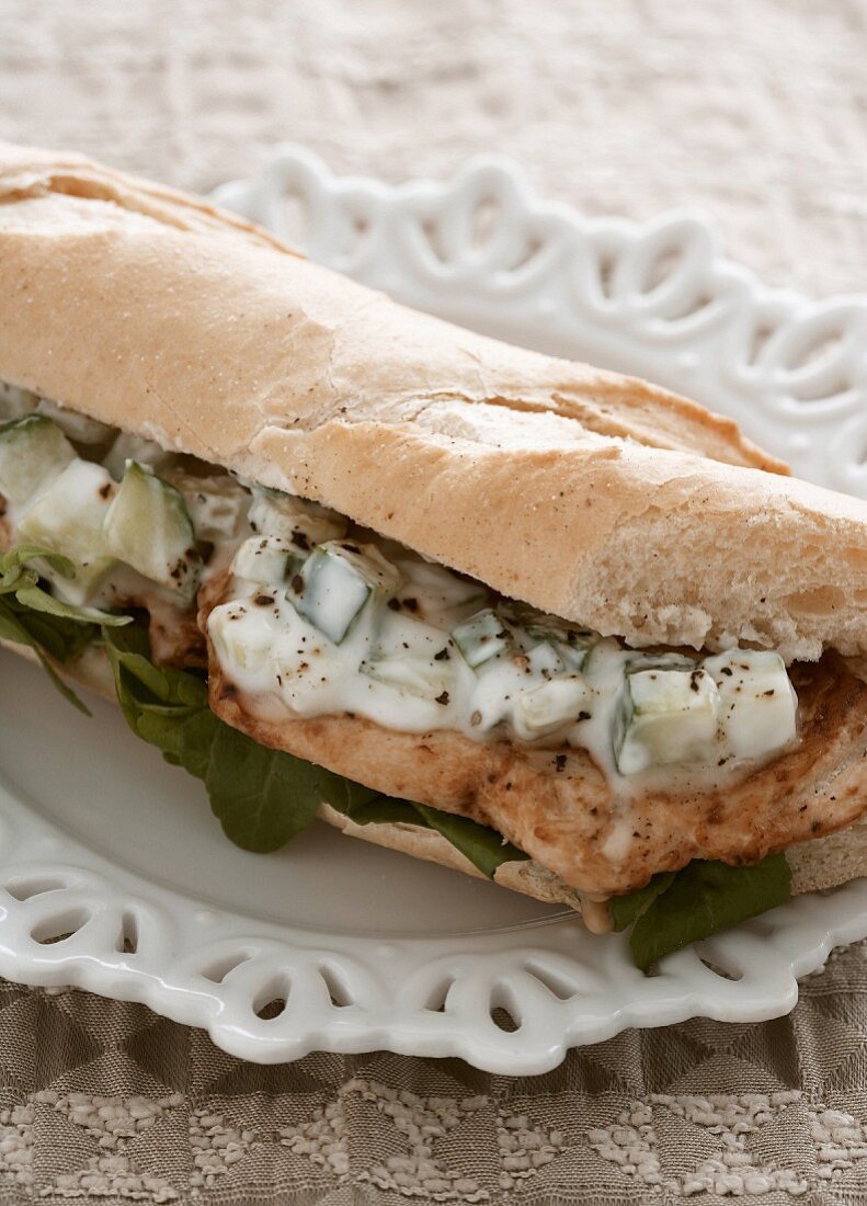 A lemon chicken baguette with a cucumber dressing